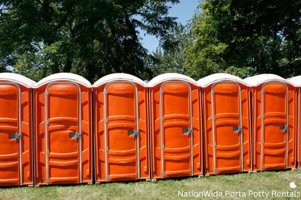 a lineup of clean and well-maintained portable loos for workers in Elko New Market, MN