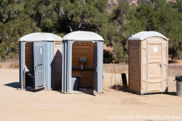 a clean row of portable restrooms for outdoor weddings or festivals in Rush City, MN